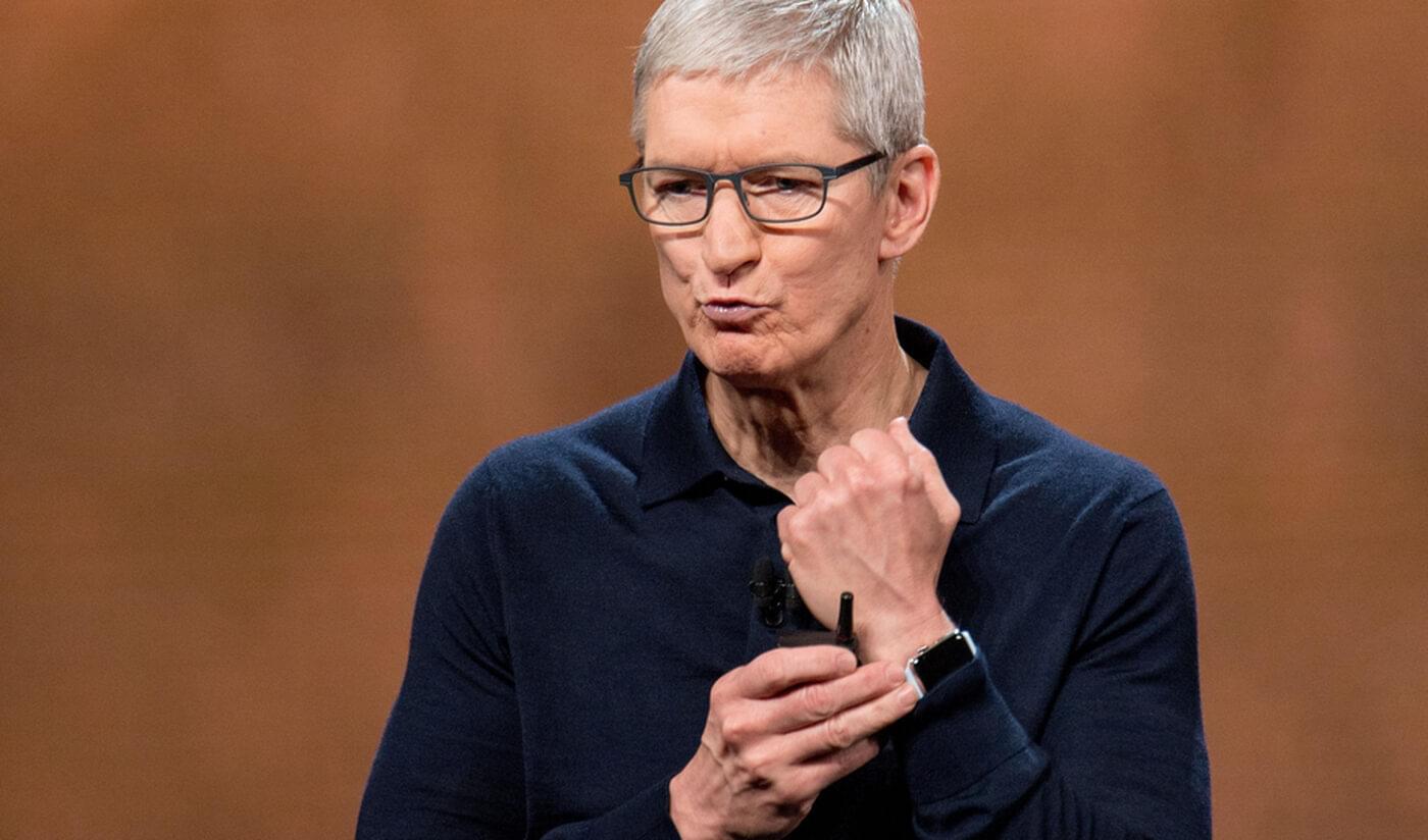 Upside-down image of Apple CEO Tim Cook showing off an Apple Watch.