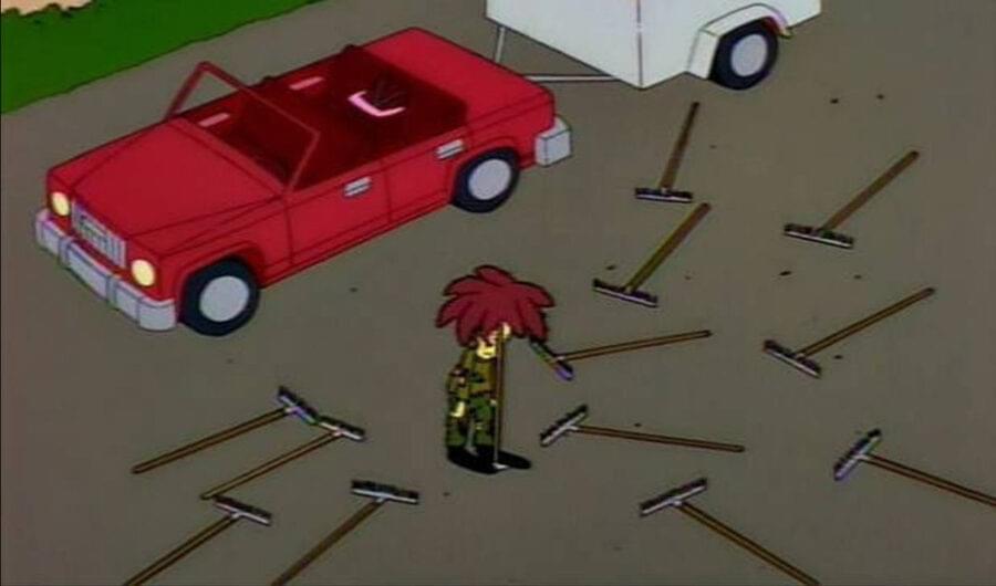 Sideshow Bob surrounded by rakes