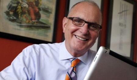 Denis Finley, then-editor of The Virginian-Pilot, at his desk.